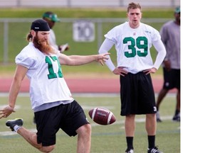 Rider punters Hugh O’Neill, left, and Ray Early in practice at Griffiths Stadium on Monday. (Greg Pender/The StarPhoenix)