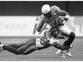 Riders defensive back Tristan Jackson, shown tackling the B.C. Lions' Shawn Gore on Friday, responded Tuesday to criticism from members of the Lions organization.