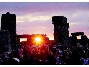 The sun rises as thousands of revellers gathered Sunday at the ancient stone circle Stonehenge to celebrate the Summer Solstice, the longest day of the year.