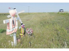 A roadside memorial marks where then 18-year-old Ashley Richards was struck and killed by a vehicle as she worked as a flag person in a construction zone south of Weyburn.