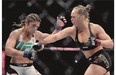 Ronda Rousey, right, fights Brazil's Bethe Correia during their bantamweight title fight at UFC 190, early Sunday.