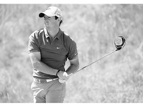 Rory McIlroy, of Northern Ireland, watches his tee shot on the seventh hole during the third round of the U.S. Open golf tournament at Chambers Bay in University Place, Wash.