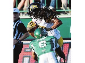 Roughriders quarterback Kevin Glenn left Sunday's game after making this tackle on Tiger-Cats defensive back Rico Murray following an interception.