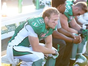 Roughriders receiver Ryan Smith, left, and teammates demonstrate their dejection Sunday after the team’s season-opening losing streak swelled to six games.