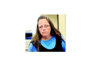 Rowan County Clerk Kim Davis listens to a customer following her office's refusal to issue marriage licences at the Rowan County Courthouse in Morehead, Ky., Tuesday.