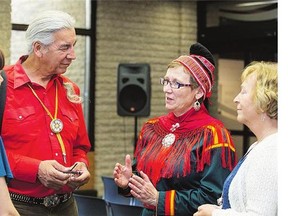 Saskatchewan resident Joseph Naytowhow chats with Else Grete Broderstad of the Arctic University of Norway at the University of Saskatchewan on Wednesday.