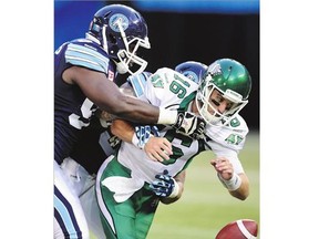 Saskatchewan Roughriders QB Brett Smith is stopped by the Toronto Argonauts during the first half of Saturday's game in Toronto. The Roughriders lost 30-26, their seventh consecutive loss this season.