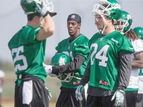 Saskatchewan Roughriders corner back Paul Woldu takes a break during training camp at Griffiths Stadium on the University of Saskatchewan campus in Saskatoon on May 31, 2015.