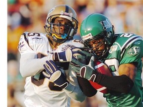 Saskatchewan Roughriders’ Eddie Davis (right) went head-to-head over the years with Winnipeg Blue Bombers’ Milt Stegall.