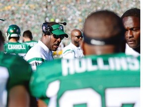 Saskatchewan Roughriders head coach Corey Chamblin, right, and director of athletic therapy Ivan Gutfriend, centre, come to the field to check on quarterback Darian Durant after he suffered his season-ending injury against the Winnipeg Blue Bombers on June 27.