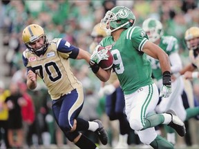 Saskatchewan Roughriders quarterback Brett Smith carries the ball during the team's victory over Winnipeg in the Labour Day Classic Sunday in Regina.