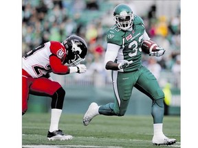 Saskatchewan Roughriders running back Jerome Messam shakes a tackle during CFL action against the Calgary Stampeders in Regina last Saturday. Messam leads the team in rushing yardage this year and is second in the league.