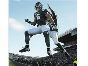 Saskatchewan Roughriders' wide receiver Rob Bagg and Naaman Roosevelt celebrates a touchdown against the Montreal Alouettes during second half CFL action in Regina on Sunday, Sept. 27, 2015. THE CANADIAN PRESS/Mark Taylor