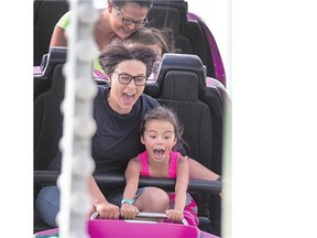 At the Saskatoon Exhibition, a screaming Emily McFadyen and her daughter Lola experienced the new roller-coaster on Wednesday.