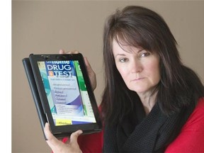 SASKATOON,SK--FEBRUARY 12/2015-- Marie Agioritis, who lost her son Kelly to an accidental overdose, wants more take home drug tests in stores. She poses with a photograph of an example on her iPad at her home, Thursday, March 12, 2015.  (GREG PENDER/STAR PHOENIX)