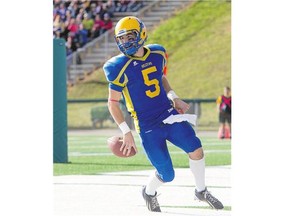 Saskatoon Hilltops quarterback Jared Andreychuk runs the ball in for a touchdown against the Winnipeg Rifles in PFC semifinal playoff action at SMF Field on Sunday The Hilltops won 49-21 and will face the Calgary Colts in the PFC final next Sunday. See story on Page C1.