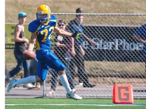 Saskatoon Hilltops receiver Evan Kopchynski runs in a touchdown against the Regina Thunder during the 2014 season in Saskatoon.