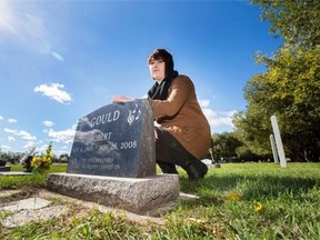 Kayla Doerksen poses at her father's gravesite in Warman on Sept. 21, 2015