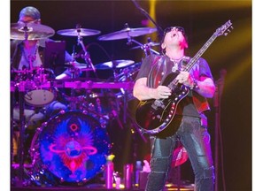 **NO REPRINTS OR SALES**SASKATOON,SK--JULY 22/2015--Neal Schon of Journey, shown, with front man Arnel Pineda, perform at SaskTel Centre, Wednesday, July 22, 2015. (Greg Pender/The StarPhoenix)