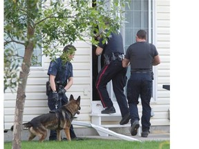 Police entered a residence at Northhampton condos on Fairbrother Crescent in Silversprings Wednesday, September 02, 2015 after a report of a man being abducted at gunpoint. At least two males and a female were detained at the scene.