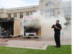 The Saskatoon Fire Department, together with Facilities Management Division, Safety Resources, Protective Services, Consumer Services and the USSU hosted a "Dorm Burn" simulation in Nobel Plaza - between the Bowl and Peter MacKinnon Building. Students, faculty and staff  watched this hot demonstration as two dorm rooms , one with a sprinkler system, were set on fire to demonstrate the effectiveness of the sprinklers, Thursday, September 03, 2015.