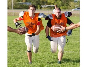 SASKATOON,SK--JULY 01/2015--Tommy Douglas Collegiate running backs Chayse Wiggins, left, and Kayden Teichroeb  pose for a photo after practice, Tuesday, September 01, 2015. (Greg Pender/The StarPhoenix)