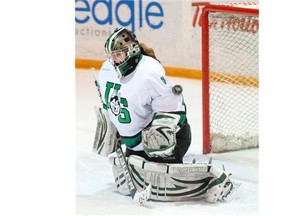 U of S goalie Cassidy Hendricks makes a save during the 3rd period as the University of Saskatchewan Huskies take on the University of Regina Cougars in Canada West Final of CIS Women's Hockey at Rutherford rink in Saskatoon, SK. on Saturday, March 1, 2014.