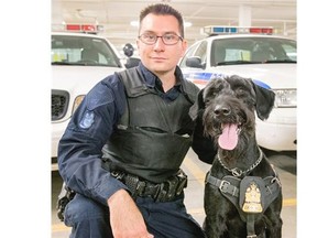 Saskatoon police constable Chad Malanowich and Tyr, a giant schnauzer who has been on the job since 2012.