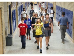 Walter Murray grade 11 student Shay Closson (centre in yellow) was among students participating in a grade nine orientation at the school on August 31, 2015 in Saskatoon.