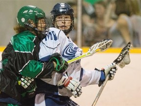 Winnipeg Blizzard Keenan Koswin is hit by Saskatchewan SWAT Brody Jorgenson in Jr B lacrosse action on Sunday.
