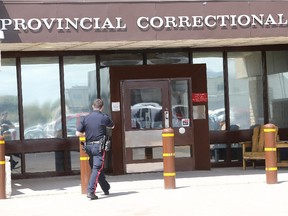 Police head into the Saskatoon Correctional Centre there after an apparent disturbance resulting in a fire in the laundry room and the kitchen there on May 27, 2015 in Saskatoon.