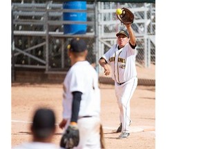 SASKATOON, SASK — North Battleford Petro Hawks first basemen Arlen Yuzicappi Calvin McNab grabs the ball to tag out a member of the Saskatoon Diamondbacks during the Softball Saskatchewan Senior A men’s provincial championship at Bob Van Impe Stadium on July 18, 2015. LIAM RICHARDS/the StarPhoenix)