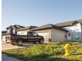 Police tape and a commissionaire stand watch over 1527 Paton Crescent on Tuesday, October 13th, 2015. Saskatoon Police are investigating a sudden death that occurred last night, a 45-year-old female was pronounced deceased at the scene.