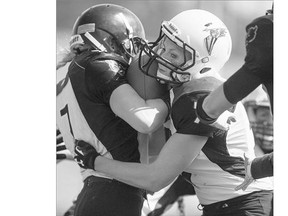 Saskatoon Valkyries defensive back Rienna Rueve tackles the Winnipeg Wolfpack's Taylor Benne at SMS Field on May 10. The Valkyries host the Wolfpack again to open the playoffs on Sunday afternoon.