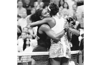 Serena Williams, left, hugs sister Venus Williams after winning their quarter-final match, 6-2, 1-6 and 6-3 at the U.S. Open Tuesday night in New York.