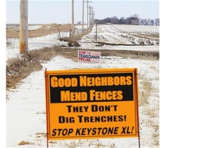 Signs opposing the Keystone XL pipeline are seen along its planned route, near Bradshaw, Neb., in 2013.