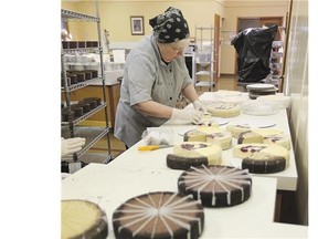 Sister Rebecca handles frozen cheesecake that will be packaged into sampler packs.