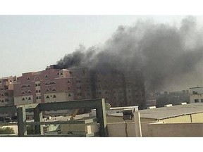 Smoke billows from a fire at a residential compound known as Radium that accommodates workers for state oil giant Saudi Aramco, in the eastern city of Khobar, Saudi Arabia.