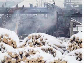 Smoke rises from the Babine Forest Products sawmill in Burns Lake, B.C., in 2012. The inquest into the explosion begins this week.