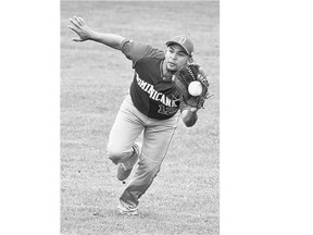 The Dominican Republic's Pablo Figuereo Ortiz fields a catch on against the Netherlands during the WBSC Men's World Softball Championship in Saskatoon on Wednesday.