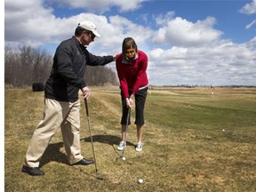 University of Saskatchewan Huskies women's basketball coach Lisa Thomaidis is taking golf lesson from Brad Birnie last year.