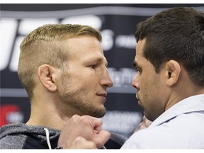 UFC bantamweight champion TJ Dillashaw from the United States, left, poses with challenger Renan Barao from Brazil during a UFC 186 media event in Montreal, Wednesday, February 25, 2015.