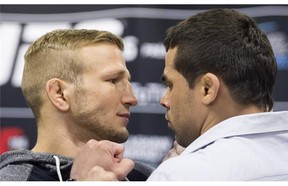 UFC bantamweight champion TJ Dillashaw from the United States, left, poses with challenger Renan Barao from Brazil during a UFC 186 media event in Montreal, Wednesday, February 25, 2015.