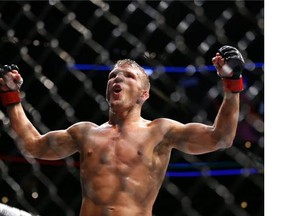TJ Dillashaw celebrates after defeating Renan Barao during their bantamweight mixed martial arts title bout during UFC Chicago on Saturday, July 25, 2015, in Chicago. Dillashaw won in the fourth round.(AP Photo/Jeff Haynes)  TJ Dillashaw