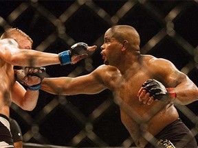 UFC Light Heavyweight champion Daniel Cormier, right, throwing a punch at challenger Alexander Gustasson during a mixed material arts bout at MMA UFC 192, Saturday, Oct. 3, 2015 in Houston.