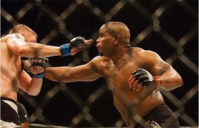 UFC Light Heavyweight champion Daniel Cormier, right, throwing a punch at challenger Alexander Gustasson during a mixed material arts bout at MMA UFC 192, Saturday, Oct. 3, 2015 in Houston.