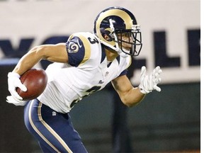 St. Louis Rams wide receiver Daniel Rodriguez runs the ball against the Oakland Raiders during the second half of an NFL preseason football game in Oakland, Calif. Rodriguez's story, which has resulted in a successful book deal and competition for film biography rights, oozes with inspiration that's more than enough to earn the respect of any first-round draft pick.