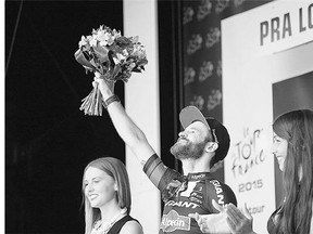 Stage winner Simon Geschke of Germany celebrates on the podium Wednesday following Stage 17 of the Tour de France. The tough Alps descent put contender Alberto Contador's tour in jeopardy due to a disasterous crash.