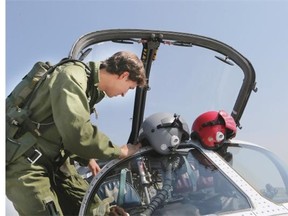 StarPhoenix reporter HenryTye Glazebrook flew with the Snowbirds on July 10, 2015 in Saskatoon. Captain Shamus Allen gets ready to fly with HenryTye.