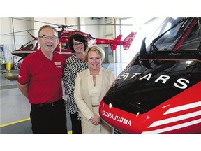 STARS Foundation executive director Rod Gantefoer, left, STARS communication lead Bonnie Monteith and STARS president and CEO Andrea Robertson at the air ambulance and rescue service's Regina hangar. (Regina Leader-Post/Bryan Schlosser)